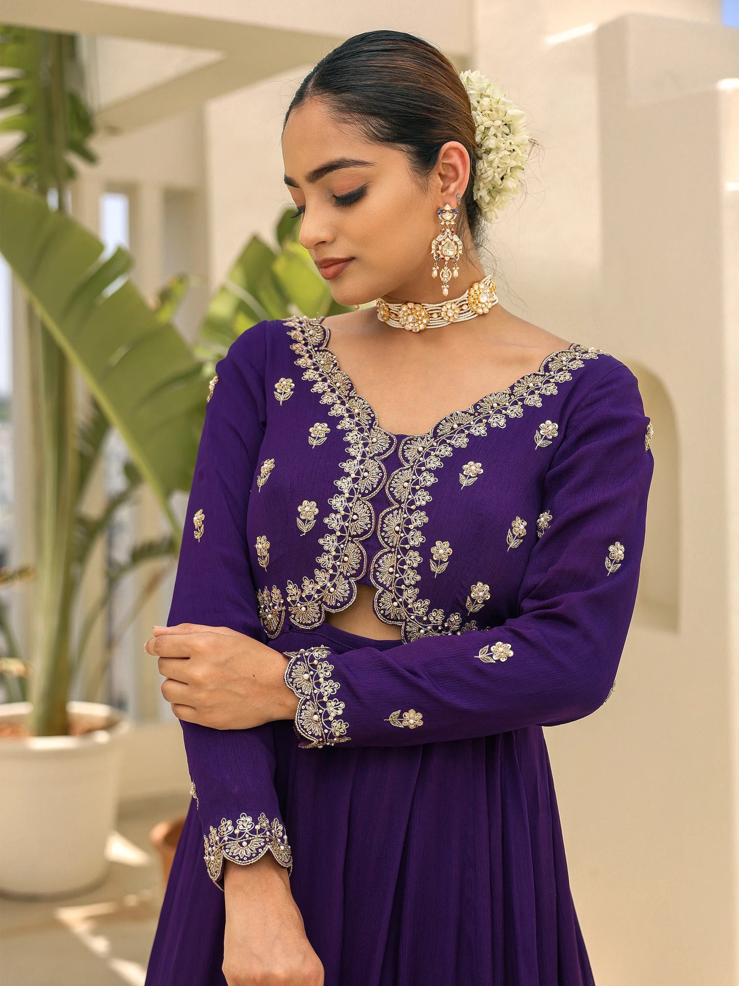 Close-up of a woman in a muted purple anarkali featuring hand embroidery on the upper bodice.