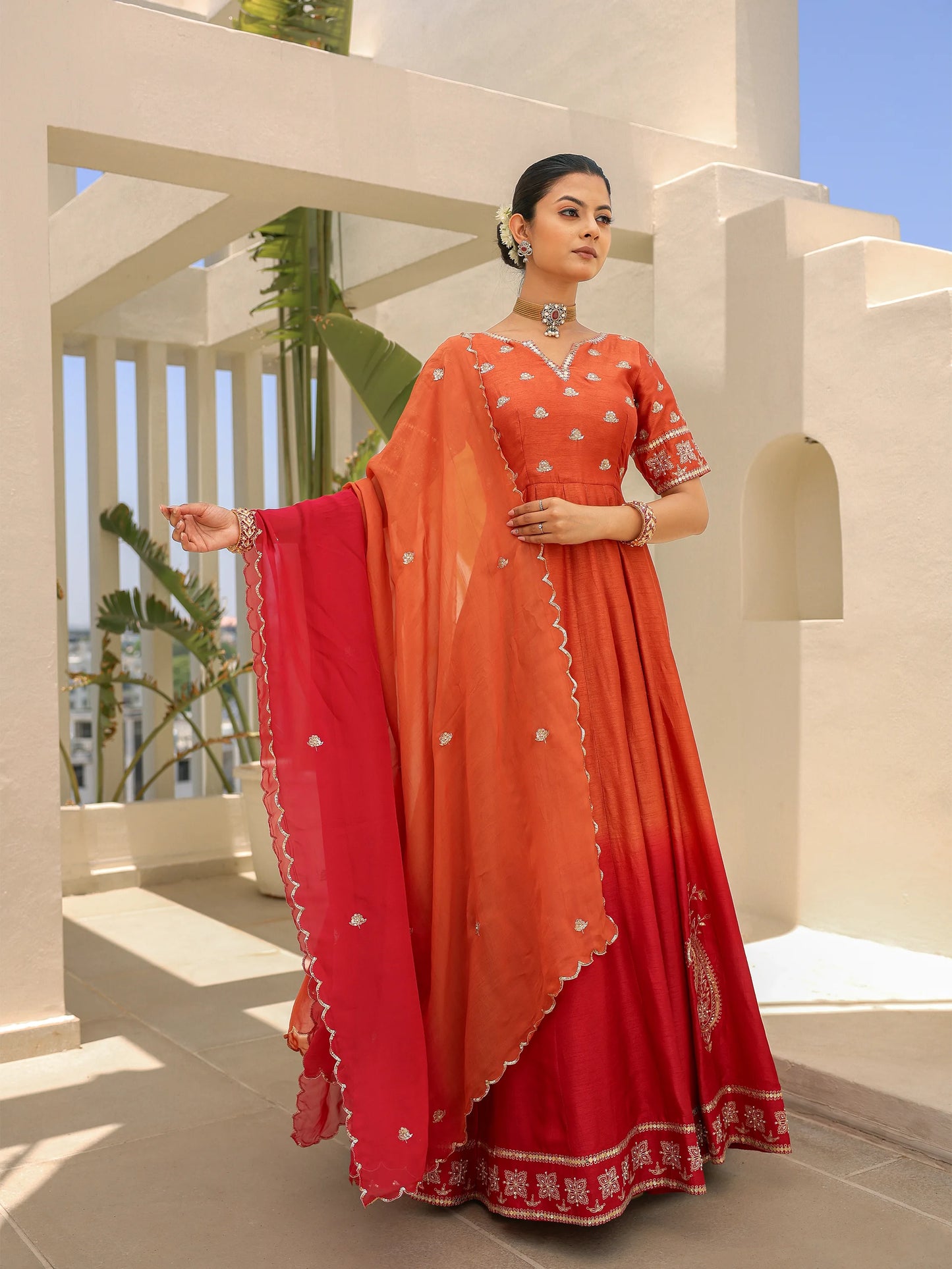 Model wearing a shaded ombre Anarkali set, featuring a handworked blouse and shaded dupatta.