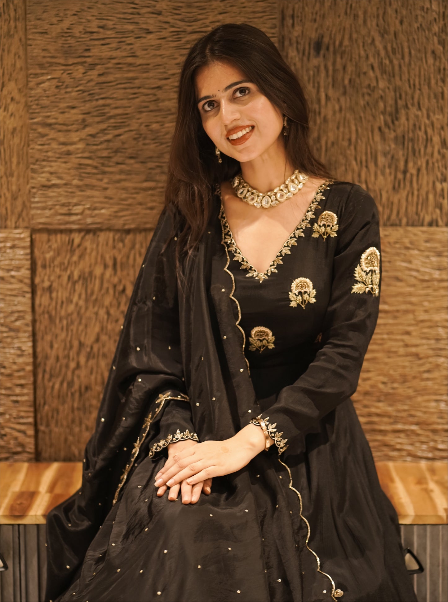 black anarkali with golden embroidery and floral motifs.