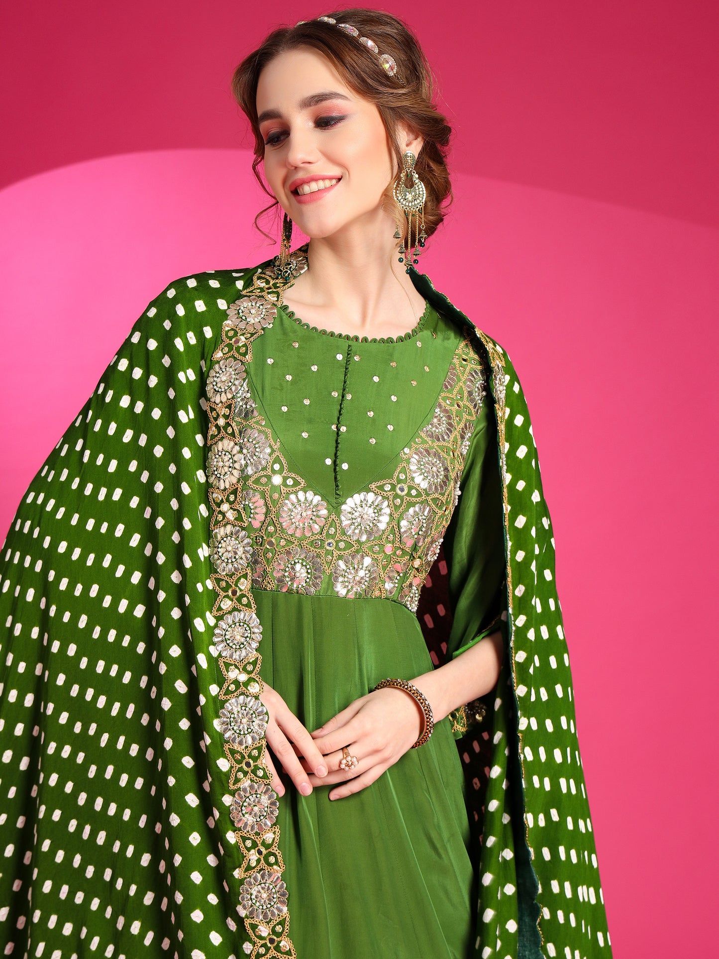 Olive green designer gown for diwali function.