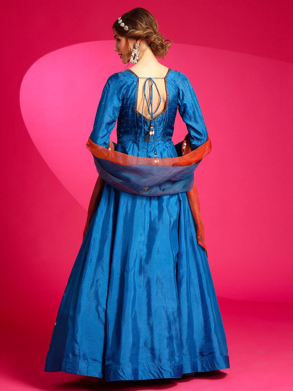 Opada silk gown with intricate details of Mirror work.