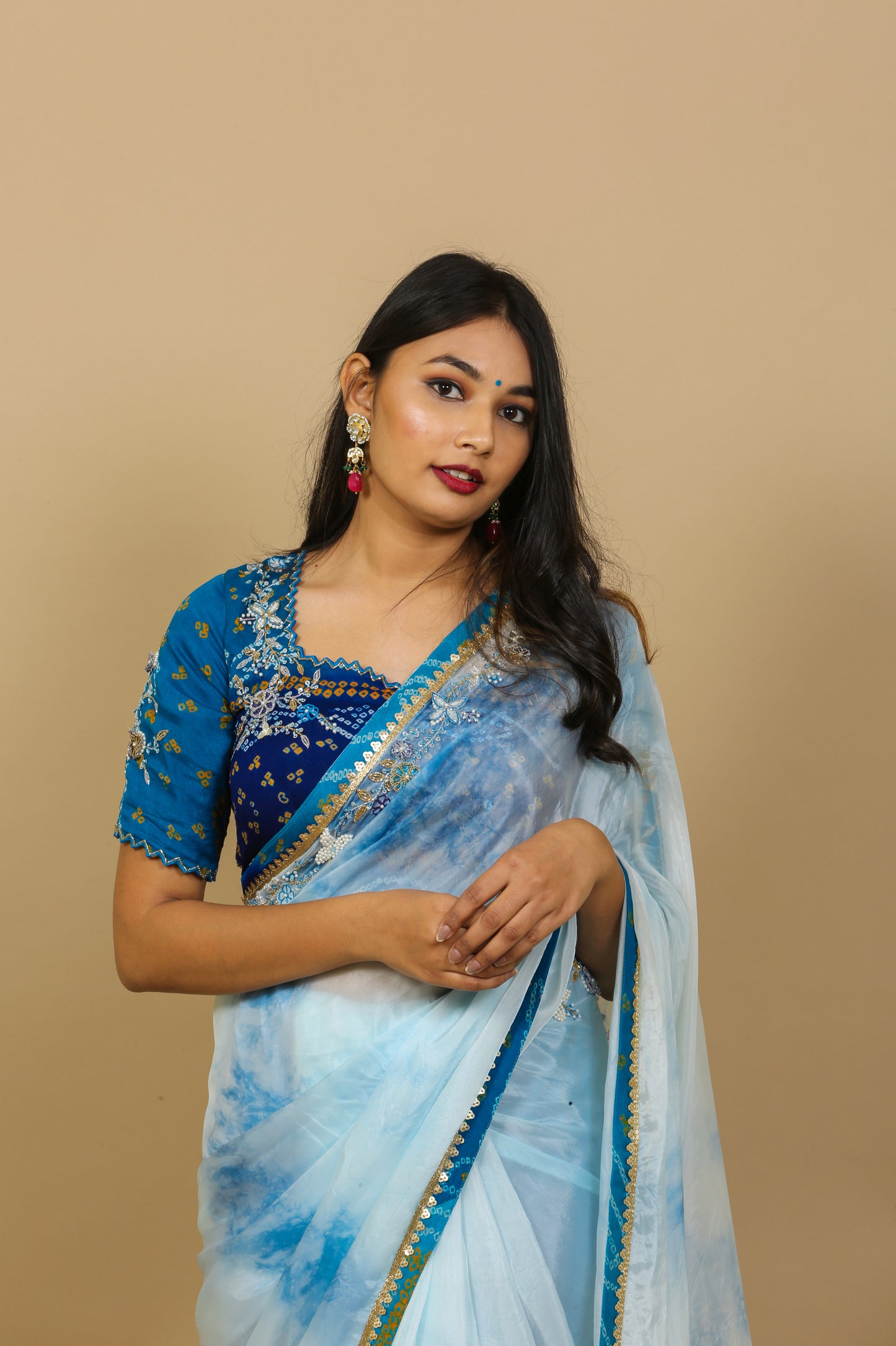 Ethnic blue saree with bandhej blouse by harry wed kelly.