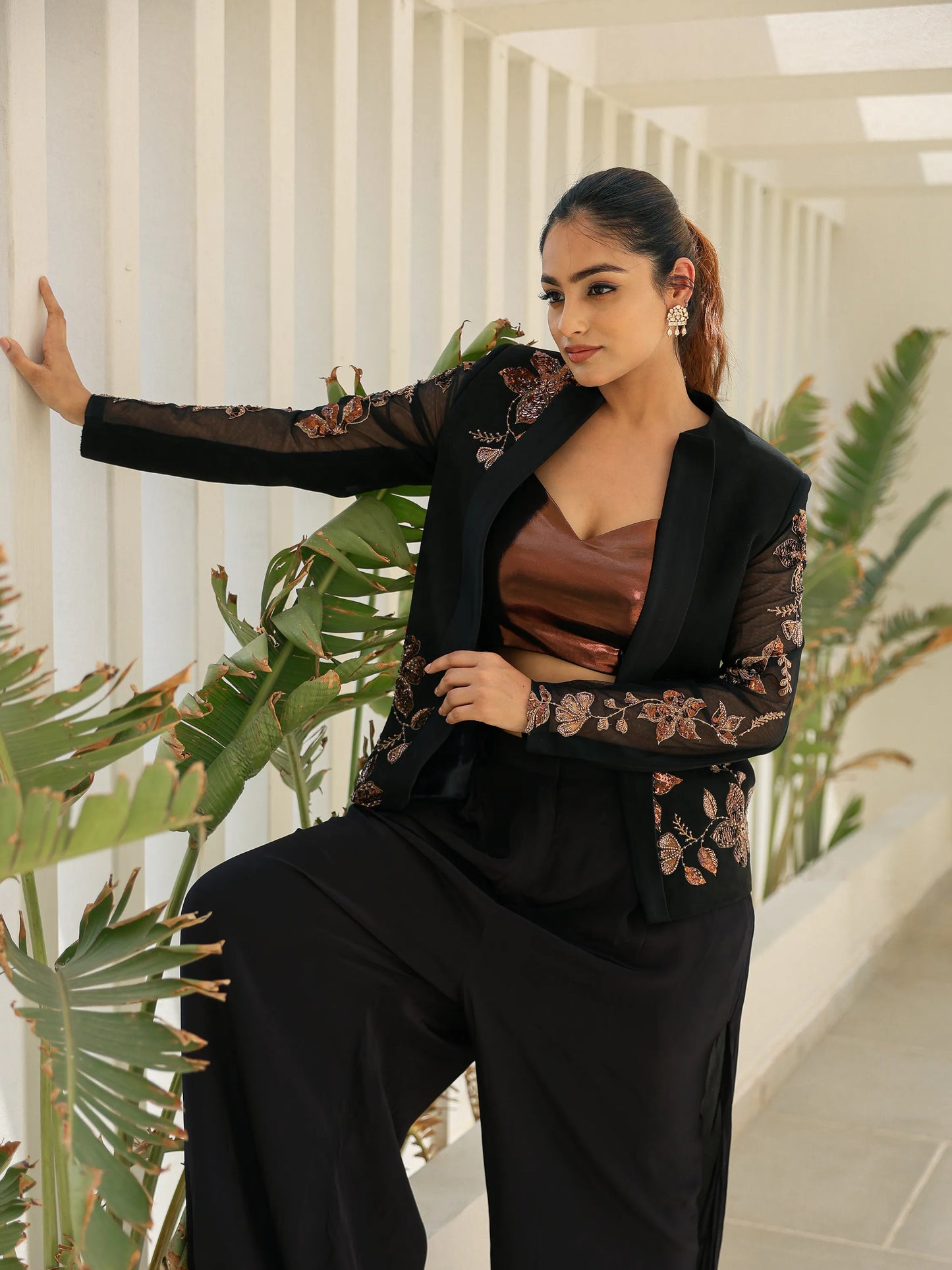Black blazer with copper floral embroidery and sheer sleeves for cocktail and evening wear.
