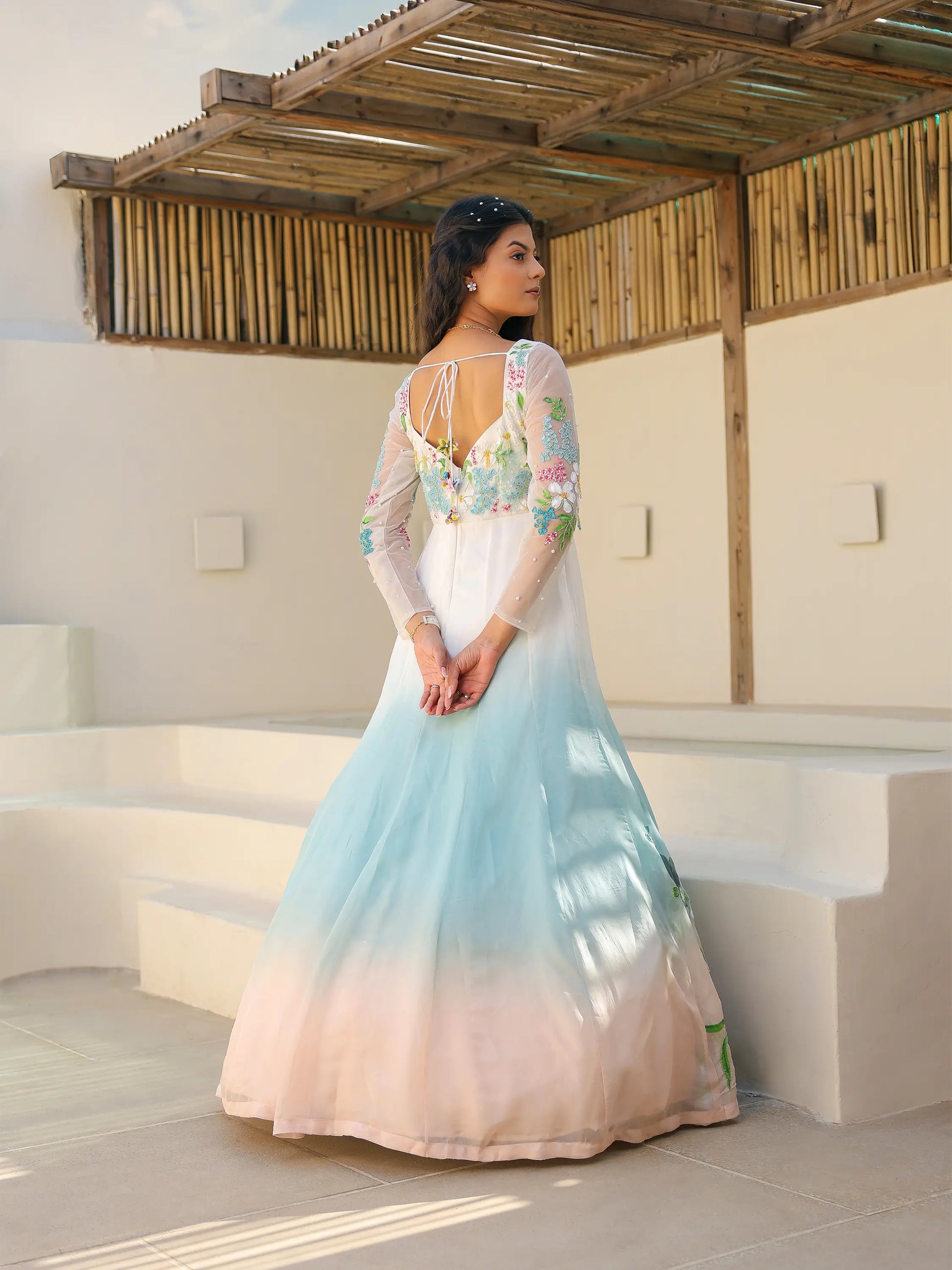 Back view of coastal ombre viscose organza gown with tie back neckline and hand painted embroidery
