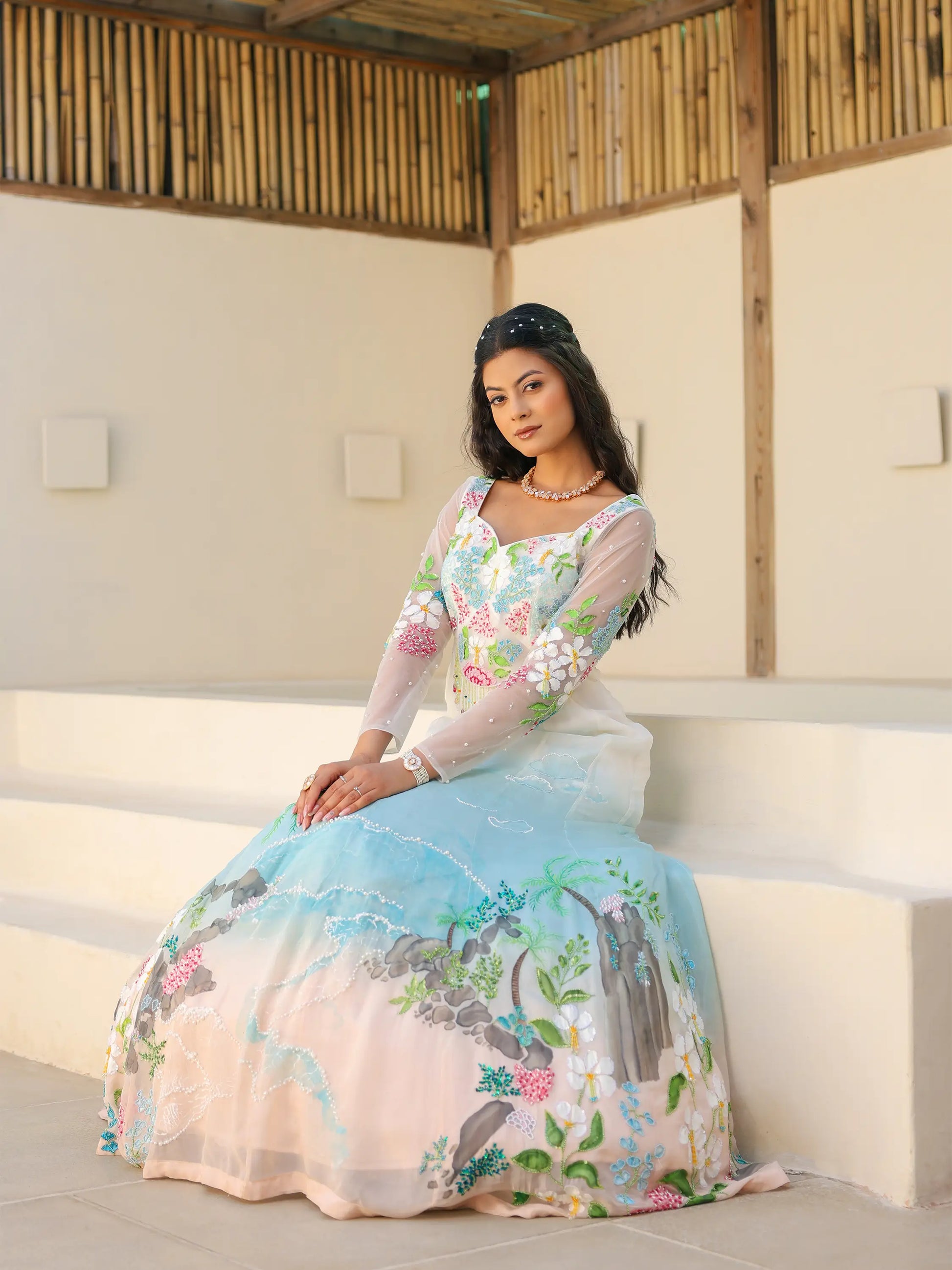 Coastal ombre viscose organza gown with tropical landscape embroidery and hand painted floral motifs