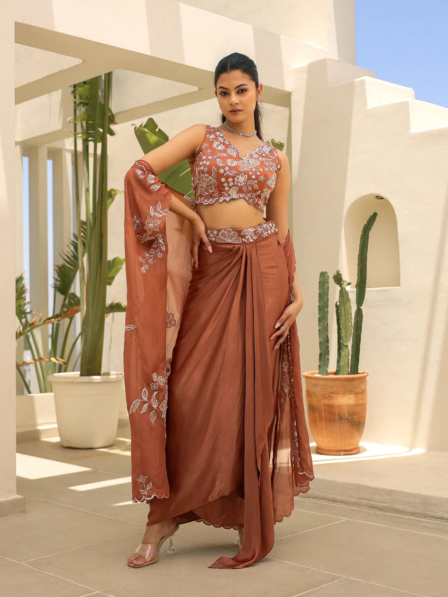 fluid draped gazi silk skirt set featuring artisanal appliqué embroidery and cutwork blouse