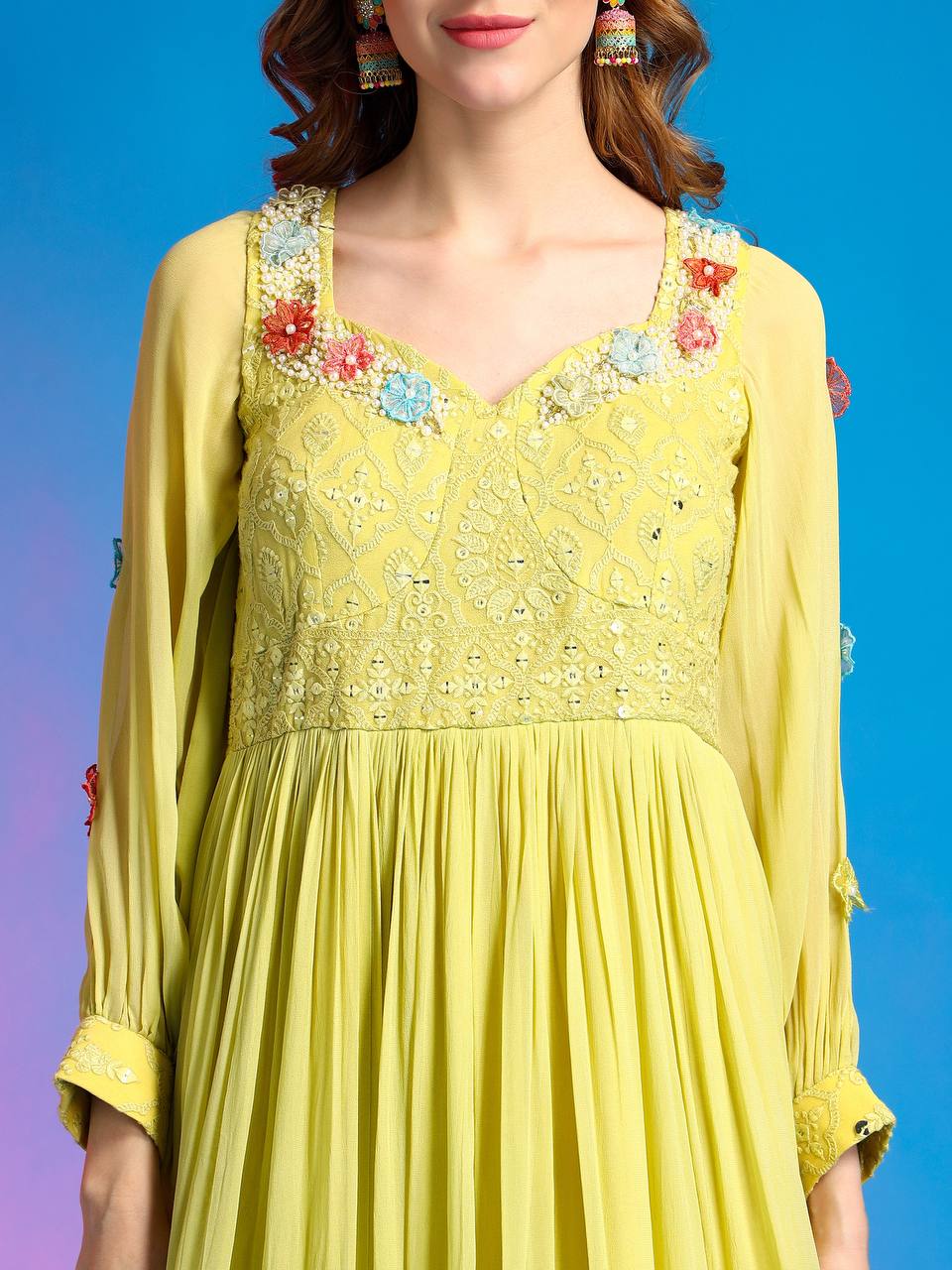 Yellow party gown with hand-embroidered 3d organza flowers.