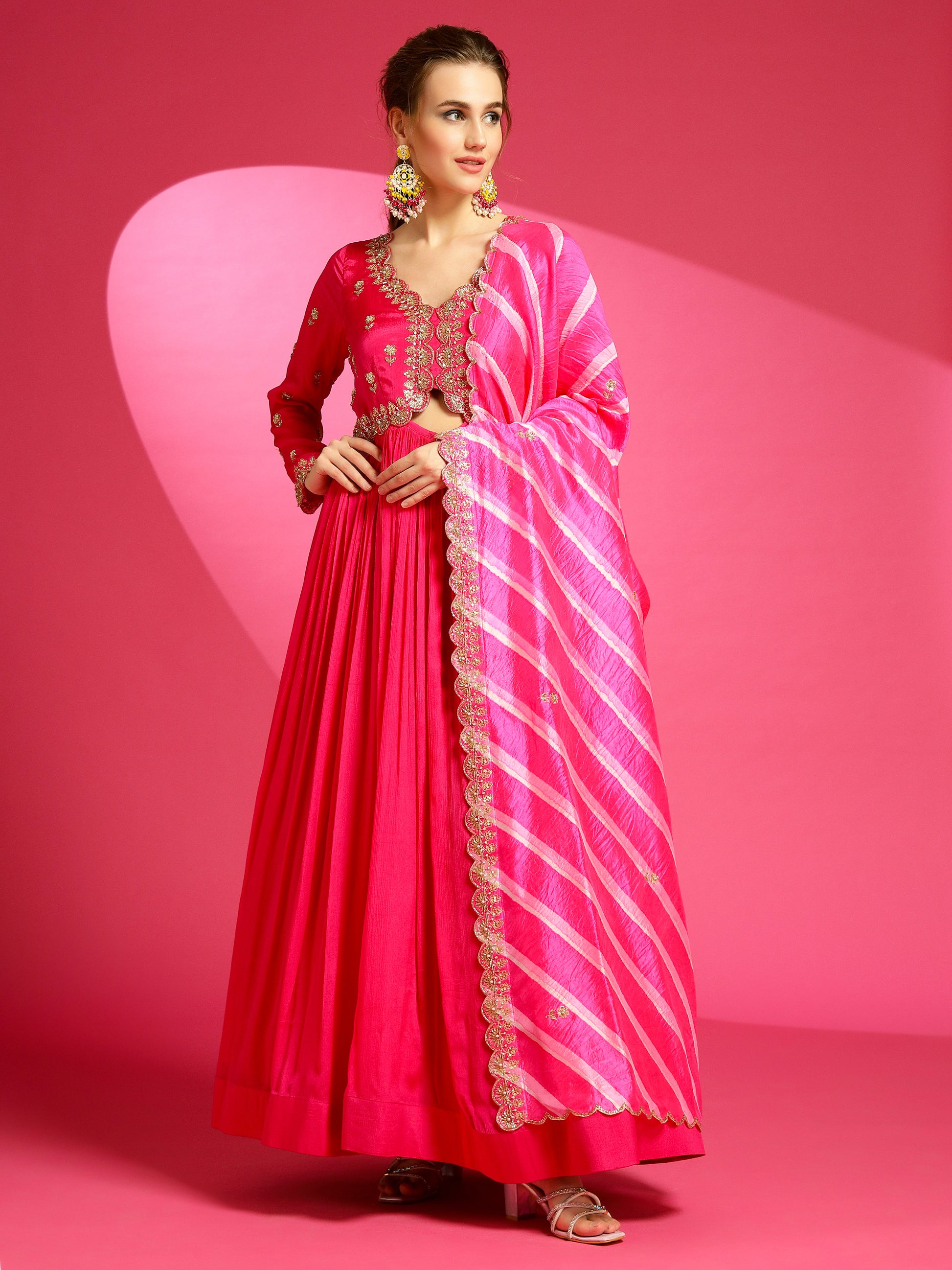 Formal evening designer gown with rani pink color.