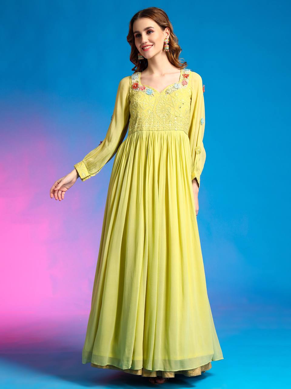 Hand-embroidered yellow designer gown for traditional events.