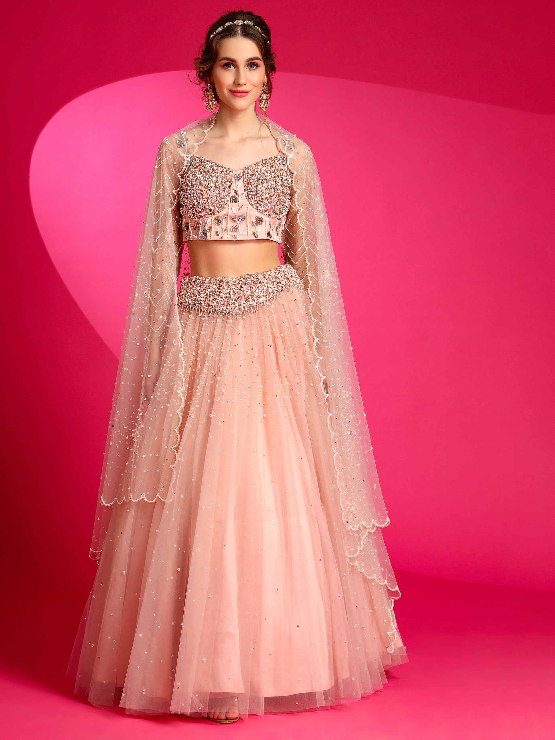 Misty rose Lehenga Set made from premium net fabric.