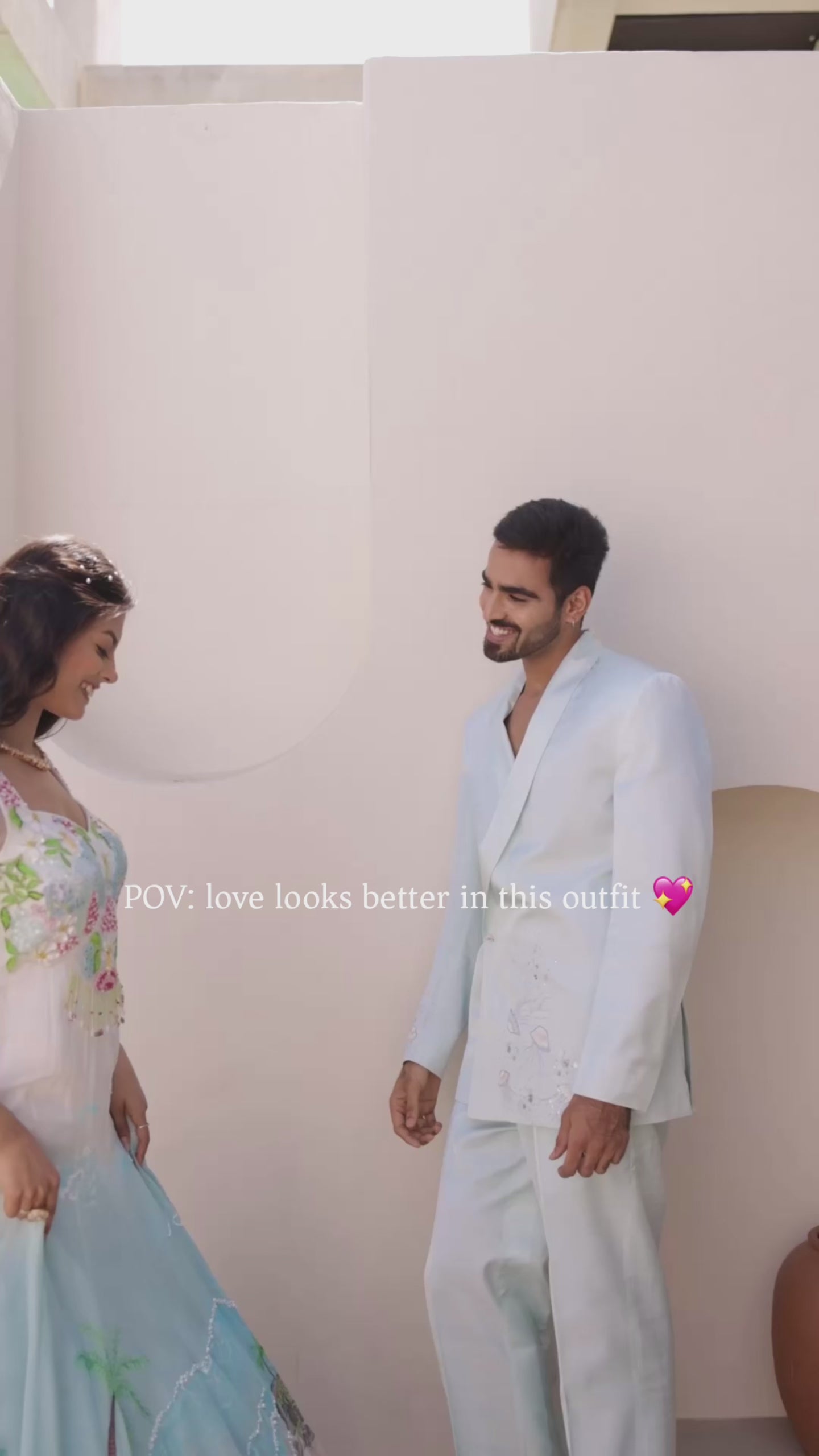 Coastal ombre viscose organza embroidered gown with hand-painted floral motifs, pearl and sequin embellishments, paired with soft net dupatta, styled for wedding and festive wear with a matching pastel suit couple look