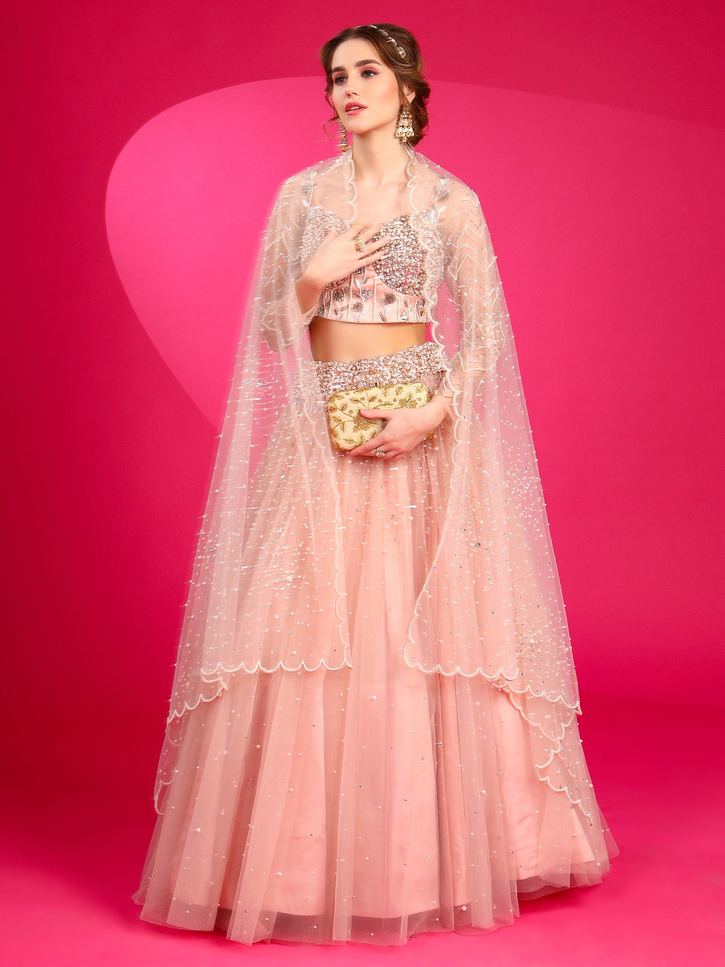 Misty rose lehenga set with dupatta for engagement ceremony.