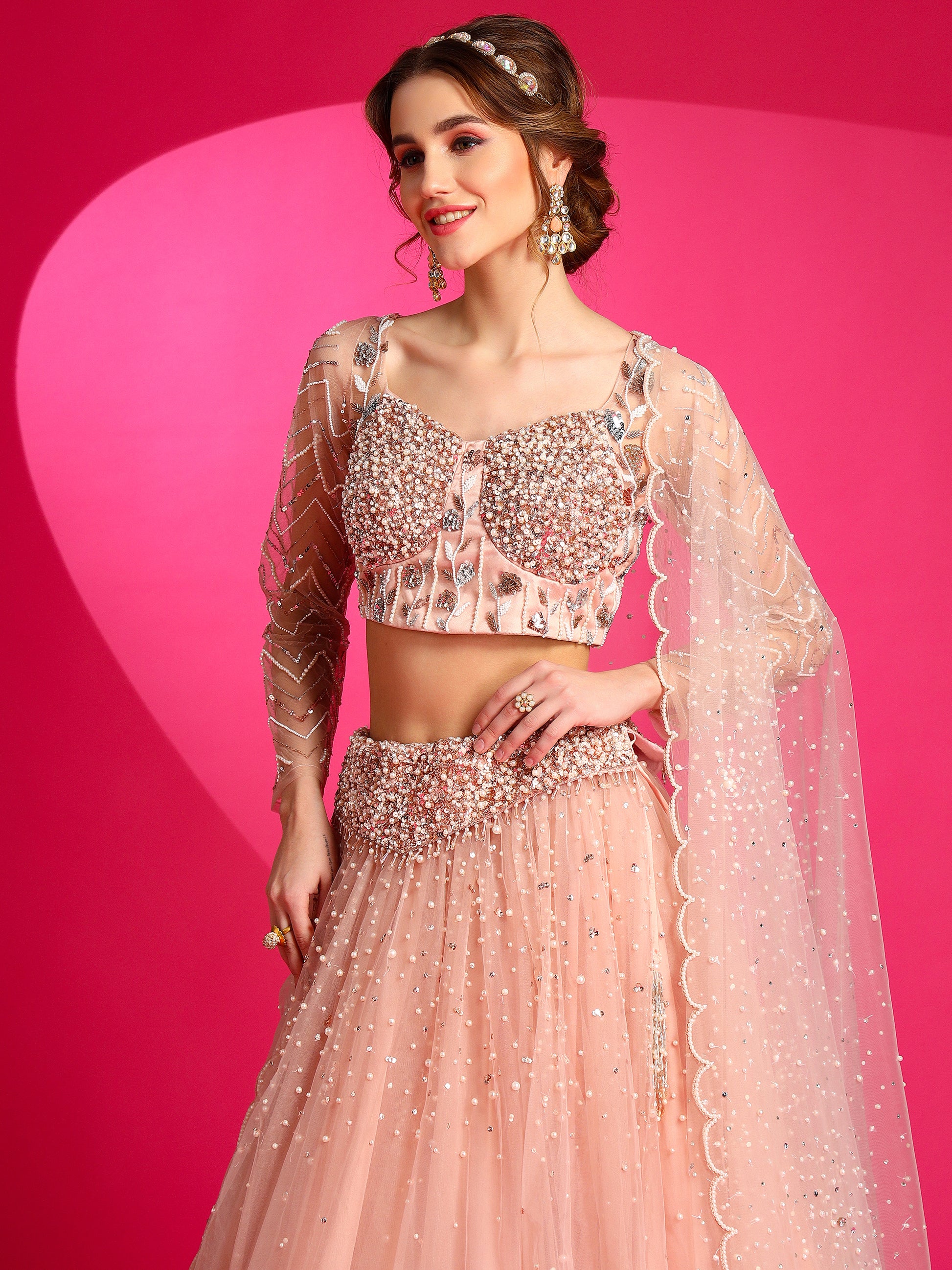 Indian designer misty rose sangeet lehenga set.